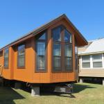 Platinum Cottages lap siding and vertical panels with batts are both popular options