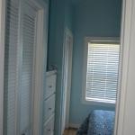 Platinum interior walls in blue with white dresser and white bifold closet doors