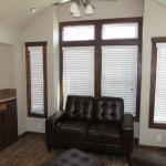 Platinum Box Bay with two windows on the sides trimmed in dark stain