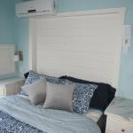 P533 beach house bedroom with white pine accent on wall